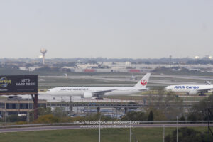 a large white airplane on a runway