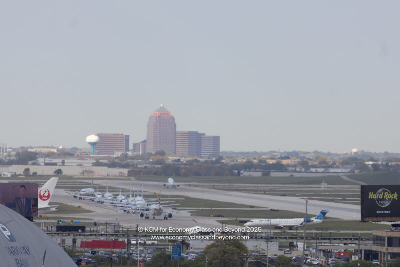 a group of airplanes on a runway