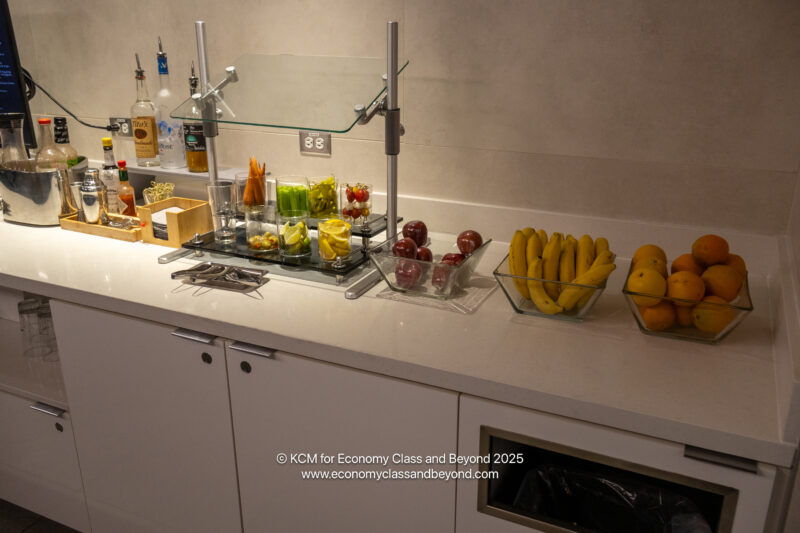 a counter with fruit and vegetables on it