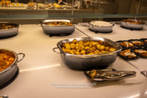 a group of silver pans with food in them