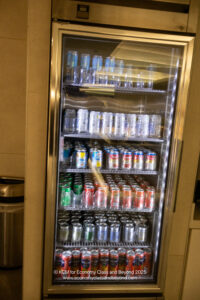 a refrigerator full of cans and glasses