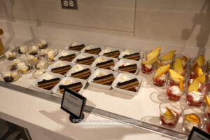 a table with desserts and glasses