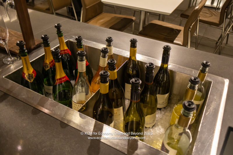 a group of bottles of alcohol in a metal container