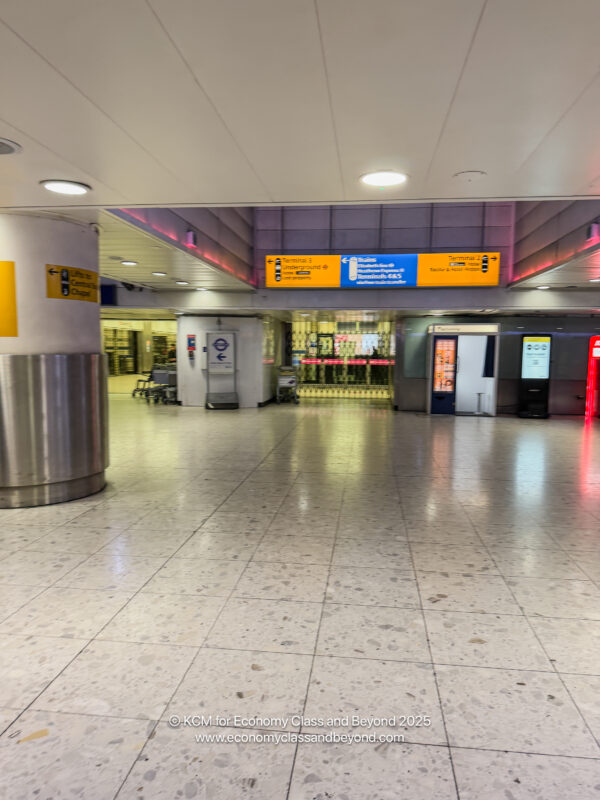 a large room with a few machines and a sign