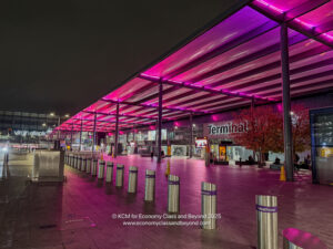 a covered area with pink lights