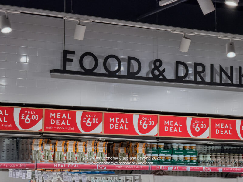 a store with a sign and a shelf with food on it