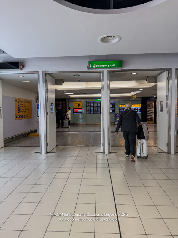 a person walking in a building with luggage