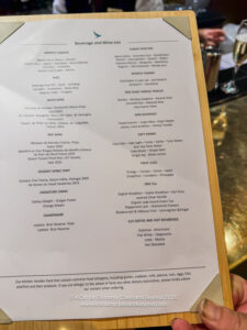 a hand holding a menu