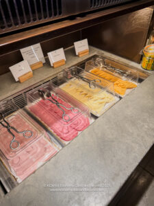 food trays of meat and cheese in plastic containers