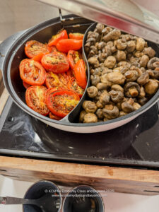a bowl of mushrooms and tomatoes