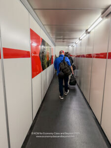 a group of people walking down a hallway