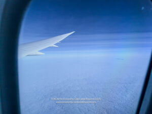 an airplane wing in the sky