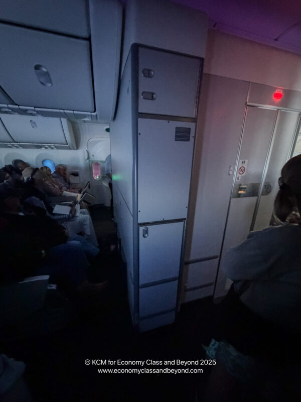 a group of people sitting in an airplane