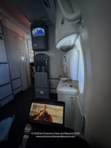 a tv and a screen in a plane