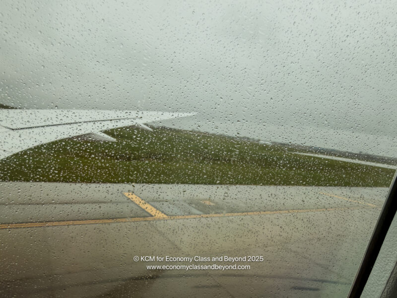 a view of a field from a window of an airplane