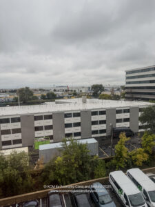 a building with cars parked in front of it