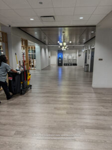 a man pushing a cart in a building