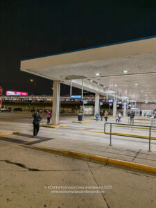 a gas station with people walking around