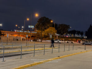 a man standing on a sidewalk