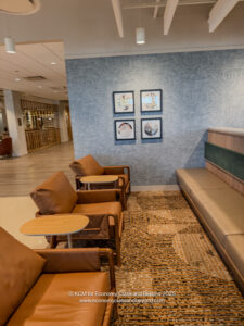 a room with a couch and chairs