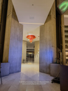 a hallway with a chandelier