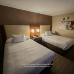 two beds in a hotel room