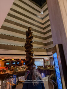 a person looking at a sculpture