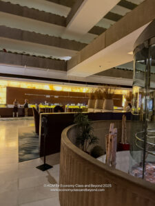 a room with a glass wall and a round glass structure