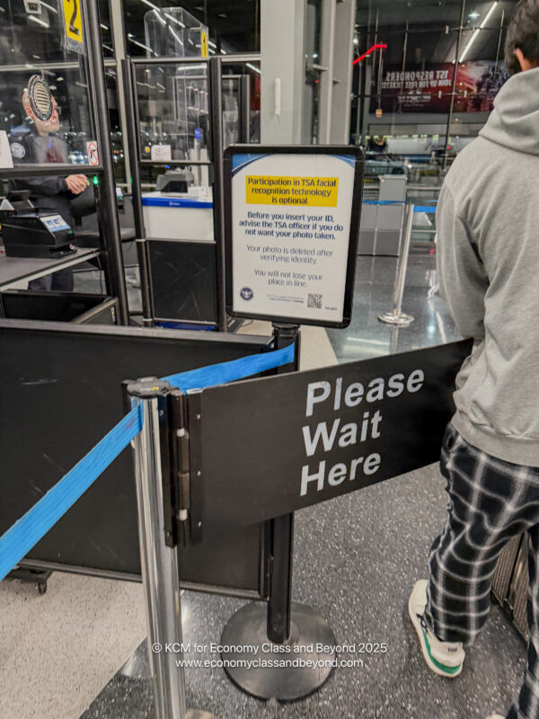 a person standing in front of a check in counter