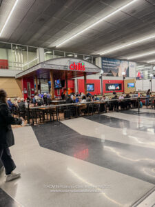 a group of people sitting at tables in a large room