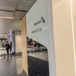 a glass wall with a sign on it