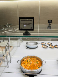 a display case with a sign on the glass