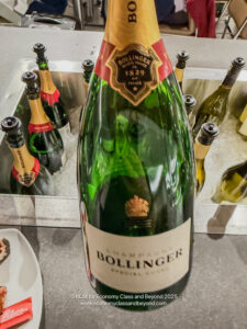 a bottle of champagne in a metal sink