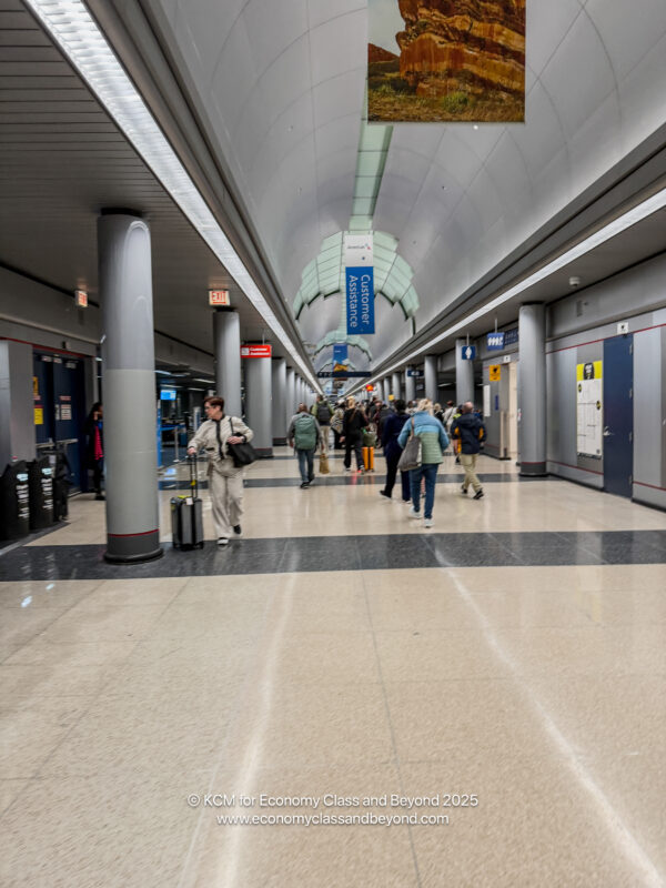 a group of people walking in a hallway