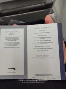 a hand holding a menu