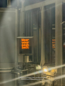 a sign with orange text