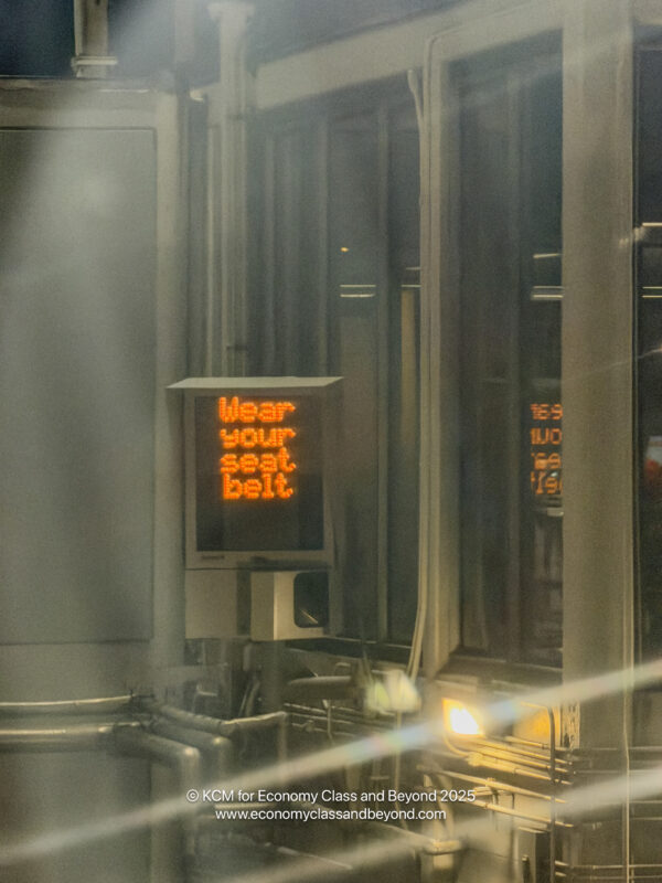 a sign with orange text