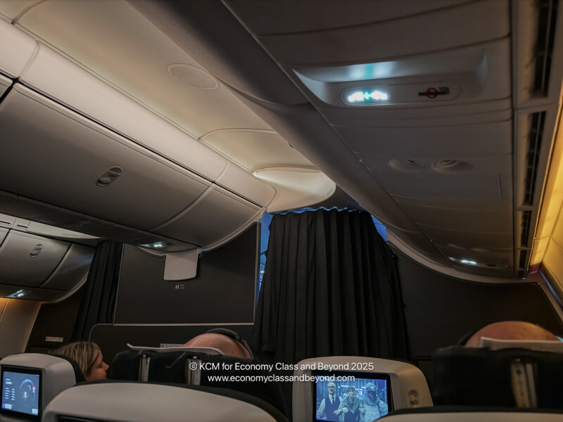 a group of people sitting in an airplane