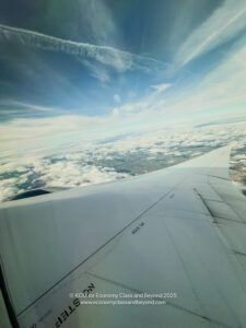 an airplane wing in the sky