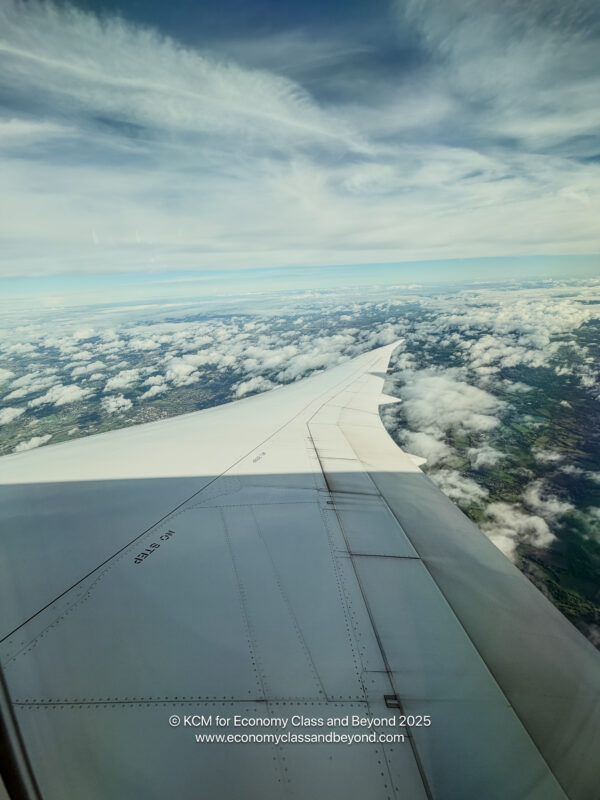 an airplane wing and clouds
