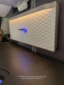 a white rectangular object with a light on it