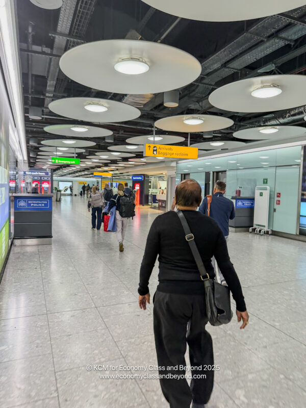 a group of people walking in a airport