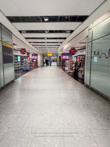 a hallway with a store in the middle