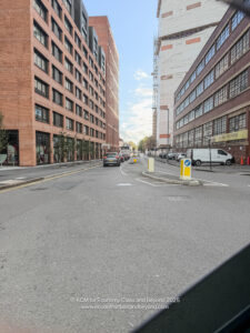 a street with cars and buildings