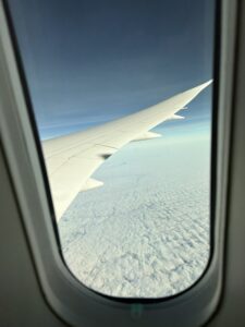 an airplane wing in the sky