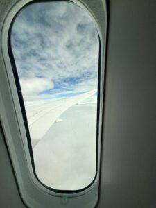a window with wing of an airplane