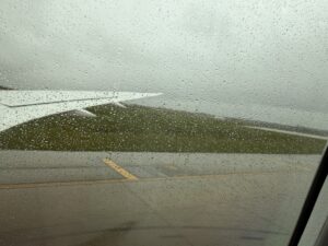 a view of a runway from a window of an airplane
