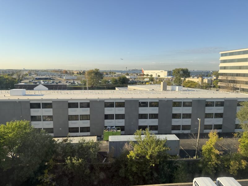a building with many windows and trees