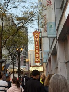 a group of people walking on a sidewalk