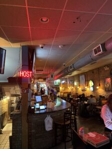 a bar with people sitting at tables